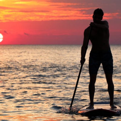 What is paddle surfing?
